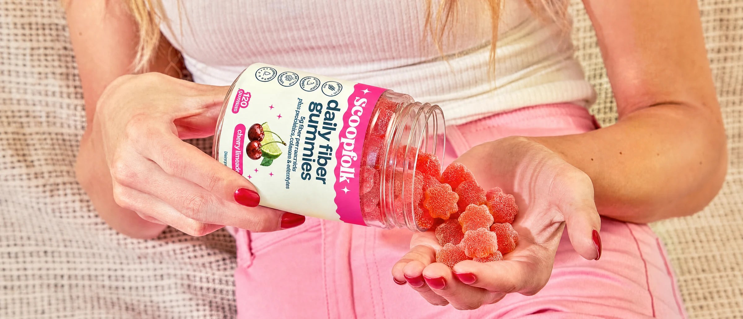 Scoopfolk cherry limeade gummies poured into a hand